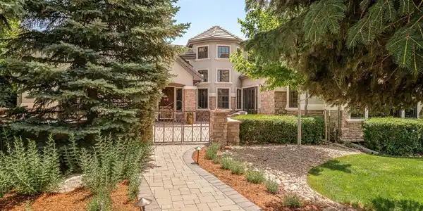Image 3: Distinctive curb appeal featuring turret architecture, custom paved entry and front patio, and mature landscaping. Image 3: Distinctive curb appeal featuring turret architecture, custom paved entry and front patio, and mature landscaping.