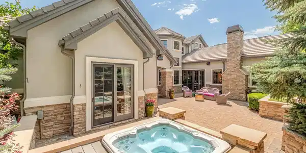 Image 4: Private patio space off of primary suite with hot tub. Image 4: Private patio space off of primary suite with hot tub.