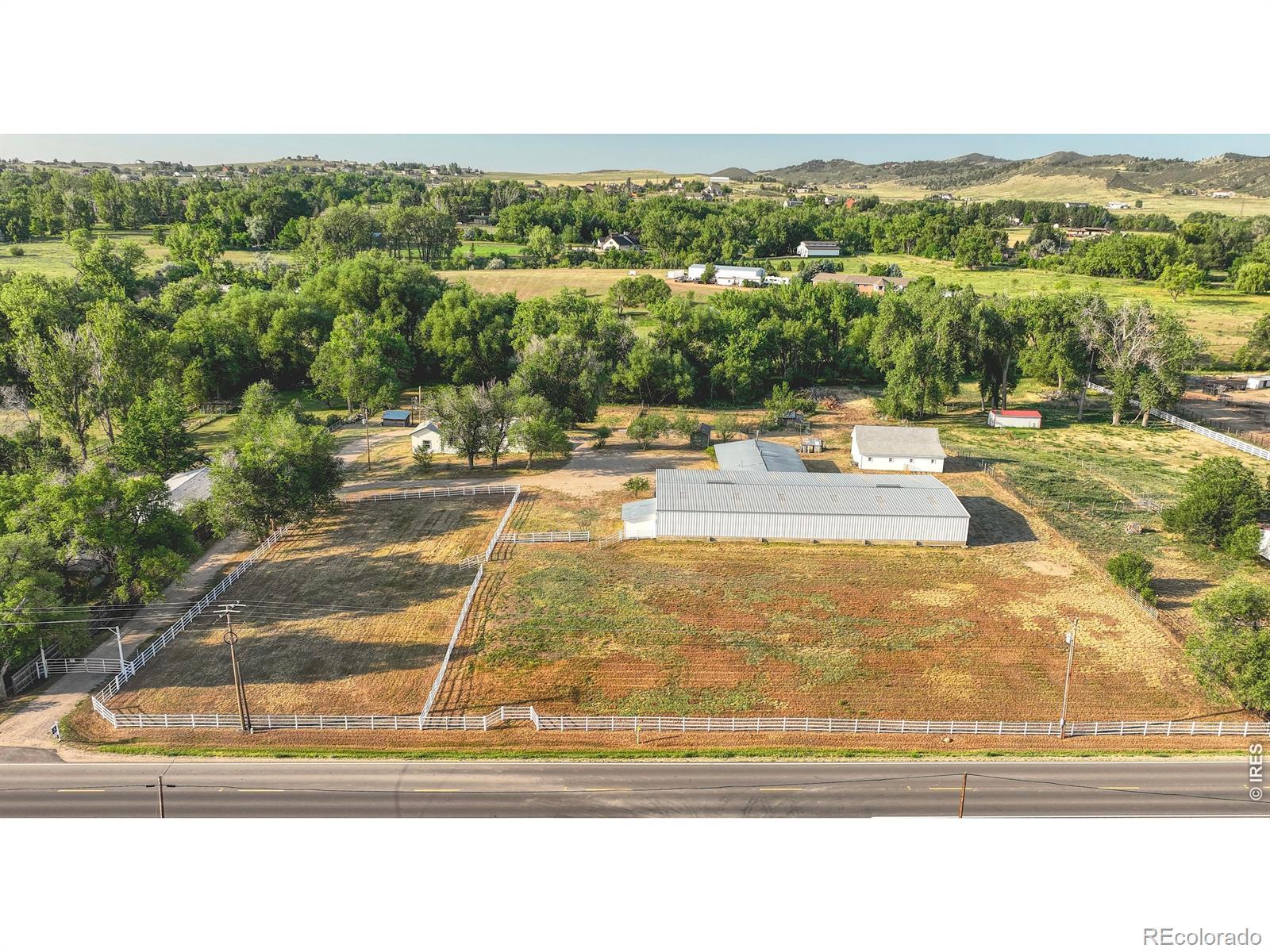 Image 1: Aerial view of property looking south