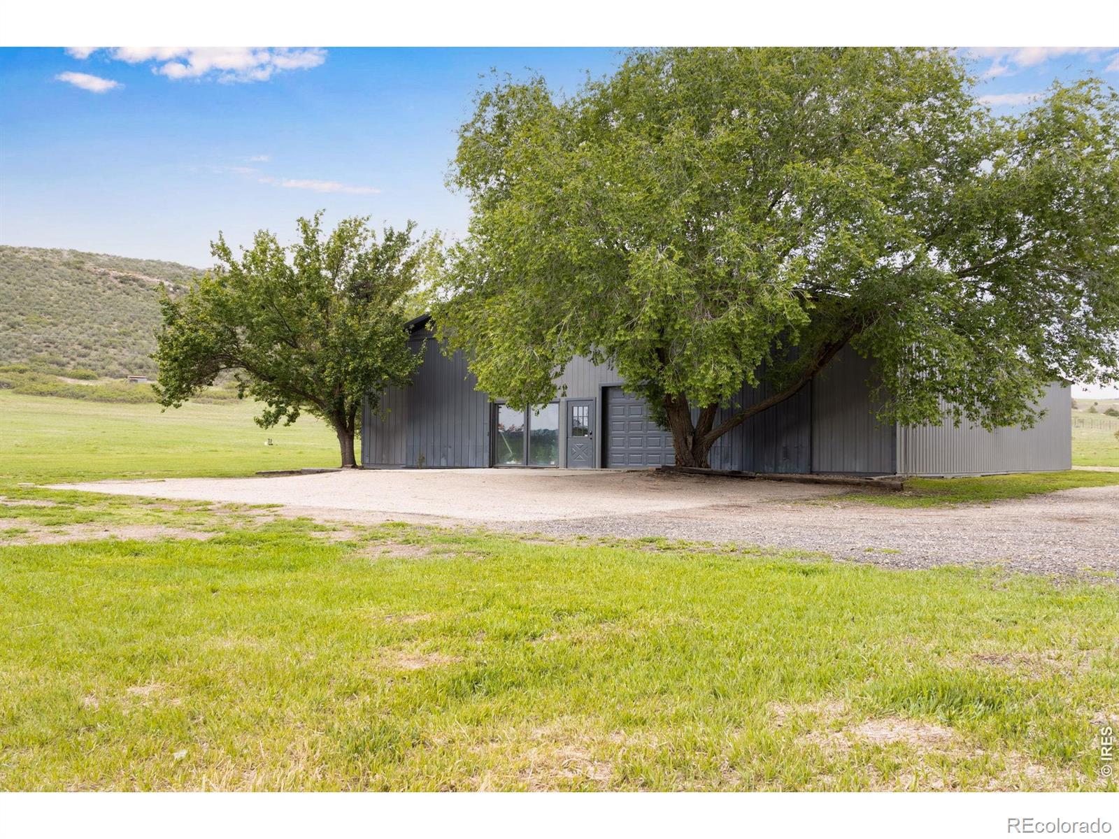 Image 3: Front of barndominium features a 9X8 overhead door Image 3: Front of barndominium features a 9X8 overhead door
