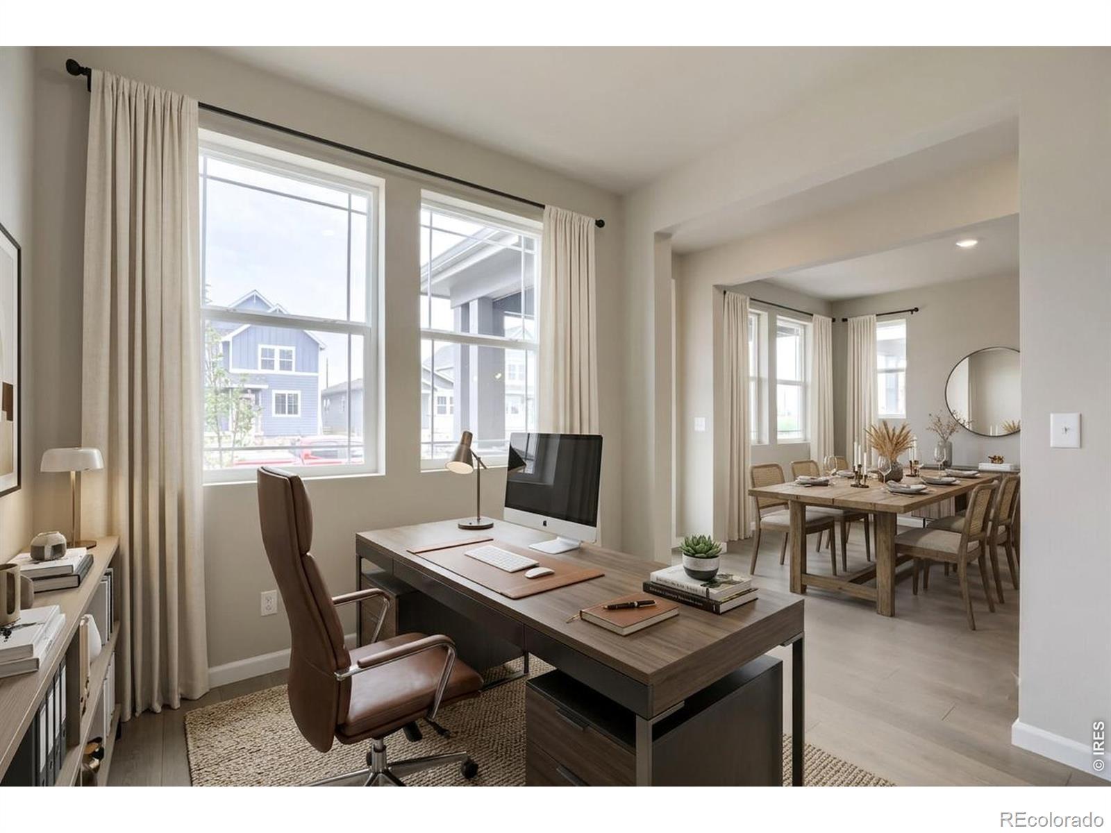 Image 2: As you enter the home, you are welcomed by a home office and dining room Image 2: As you enter the home, you are welcomed by a home office and dining room