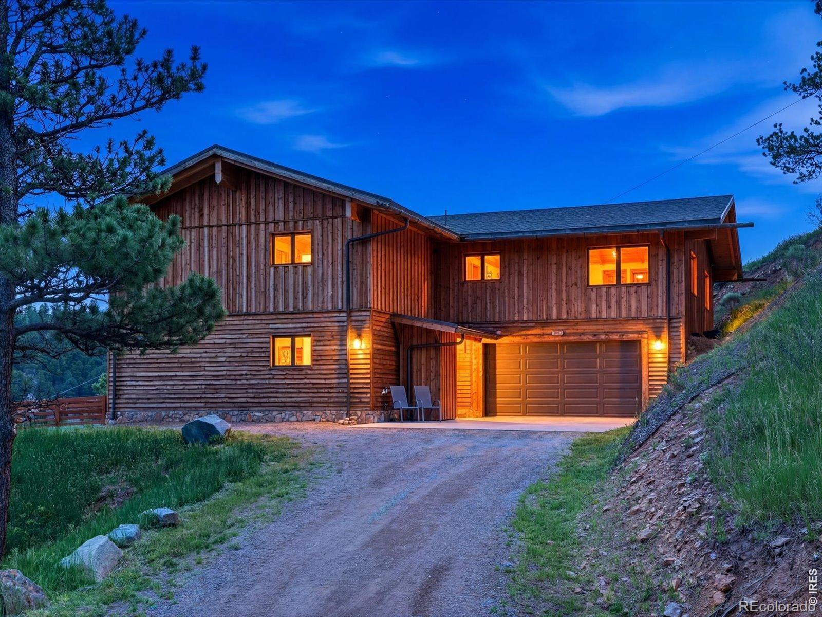 Image 2: Feel the perfection - this homes striking wood-clad exterior and mountain-modern design. Nestled into the hillside, the residence offers privacy, character, and a seamless connection to the surrounding land. Image 2: Feel the perfection - this homes striking wood-clad exterior and mountain-modern design. Nestled into the hillside, the residence offers privacy, character, and a seamless connection to the surrounding land.