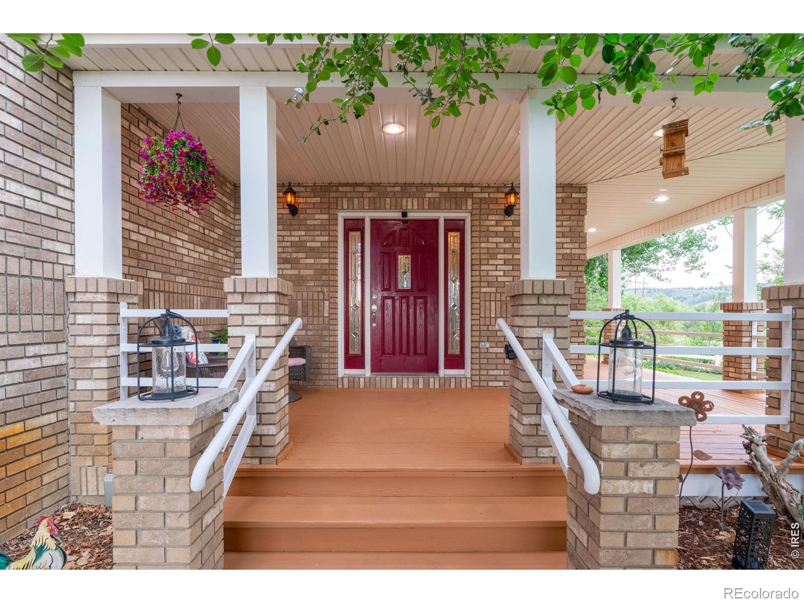 Image 4: Brick columns and a deep covered porch frame the front entry. Image 4: Brick columns and a deep covered porch frame the front entry.