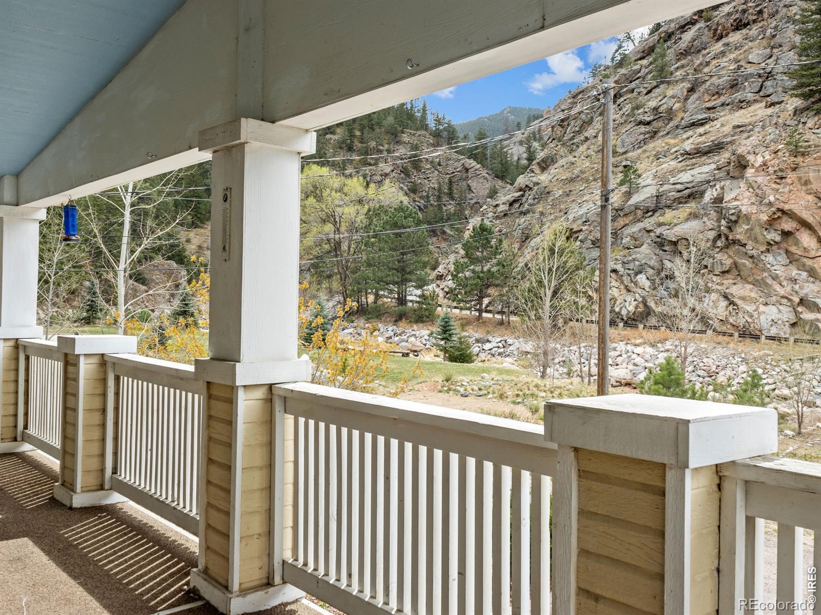 Image 2: Fish from your own property or simply relax and enjoy the stunning river and mountain views from the expansive covered front porch Image 2: Fish from your own property or simply relax and enjoy the stunning river and mountain views from the expansive covered front porch