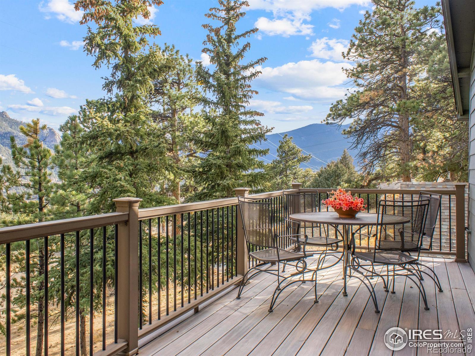 Image 2: Outdoor living shines with mountain views from the front deck.