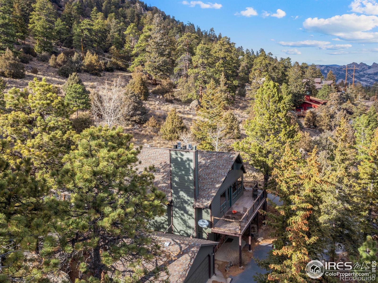 Image 3: Beautifully wooded one-acre lot full of rock outcroppings to explore.