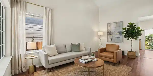Image 2: Staged living room with cathedral ceiling and ceiling fan Image 2: Staged living room with cathedral ceiling and ceiling fan