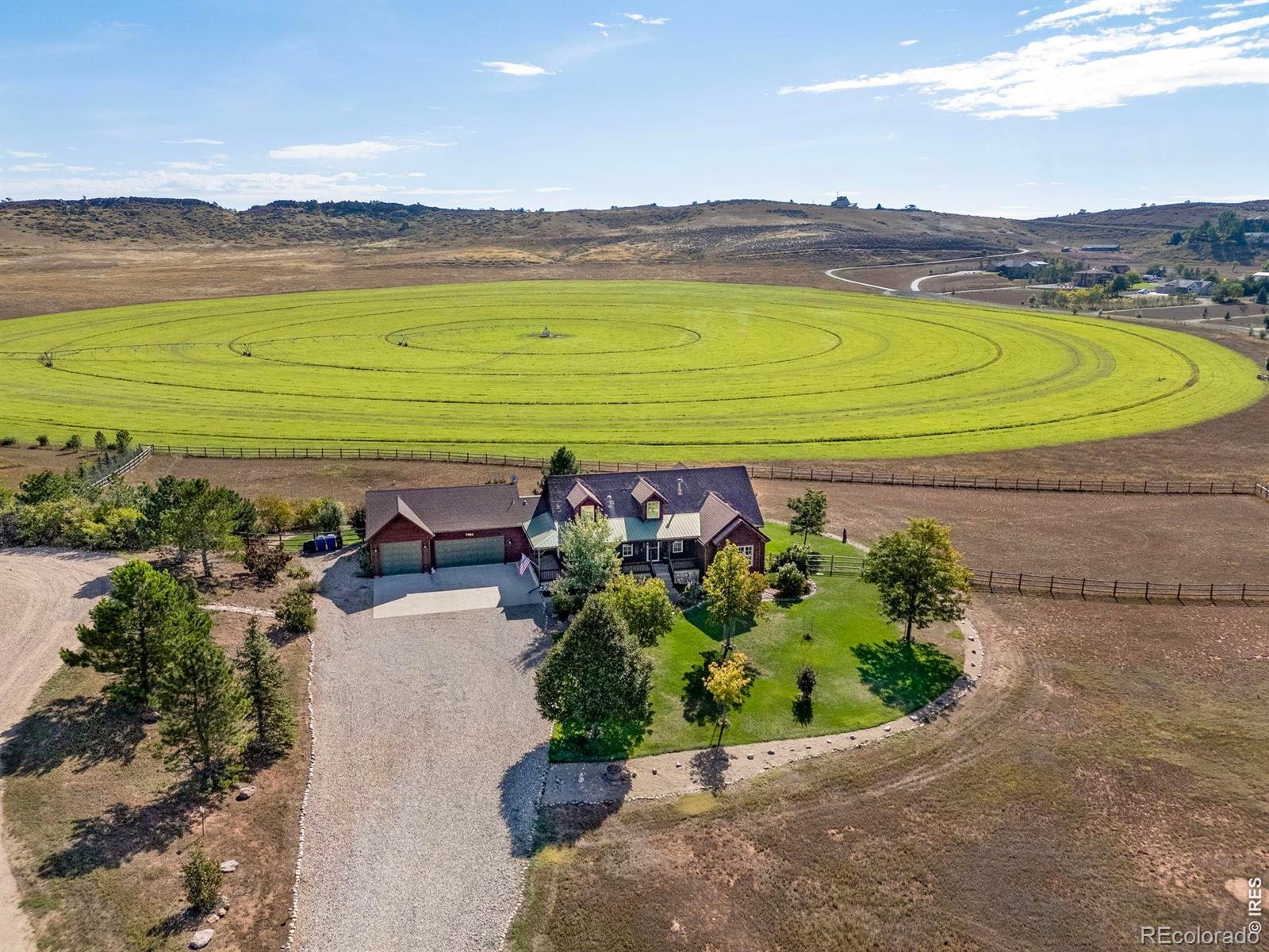 Image 3: Tucked at the end of a cul-de-sac on the West side of town and backing up to conservation land.  (From Summer/Fall View)