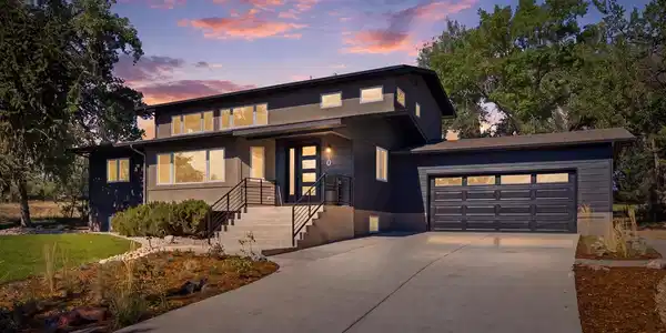 Image 4: New front steps and a new garage door create those proper entryways that the home needed. Image 4: New front steps and a new garage door create those proper entryways that the home needed.