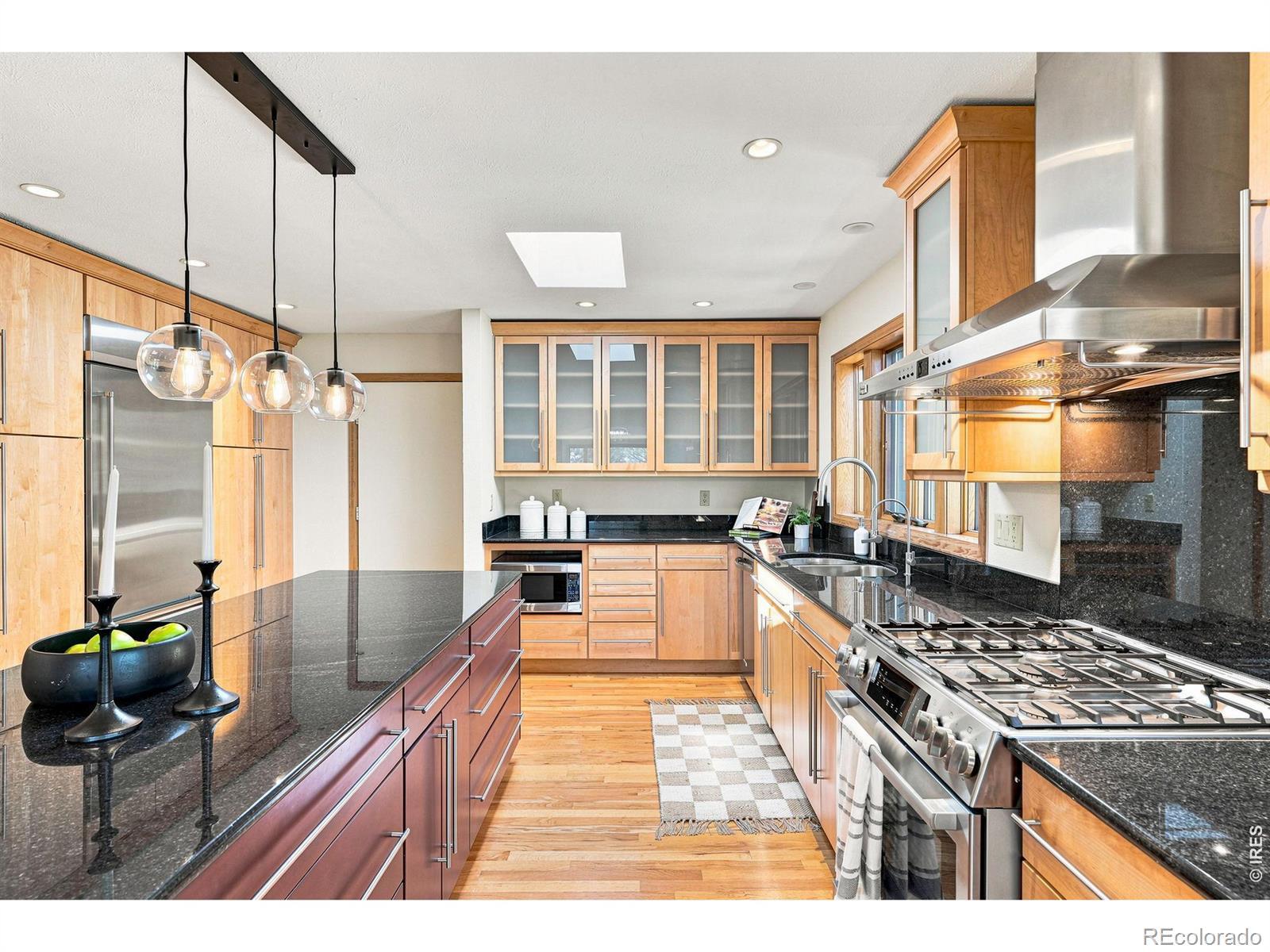 Image 4: The spacious kitchen with gas range offers tons of storage and multiple eating areas, and direct access to the 3-car garage.