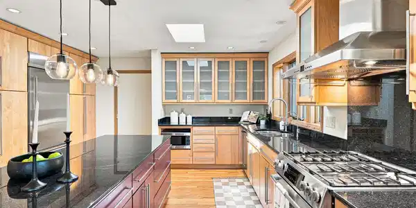 Image 4: The spacious kitchen with gas range offers tons of storage and multiple eating areas, and direct access to the 3-car garage.