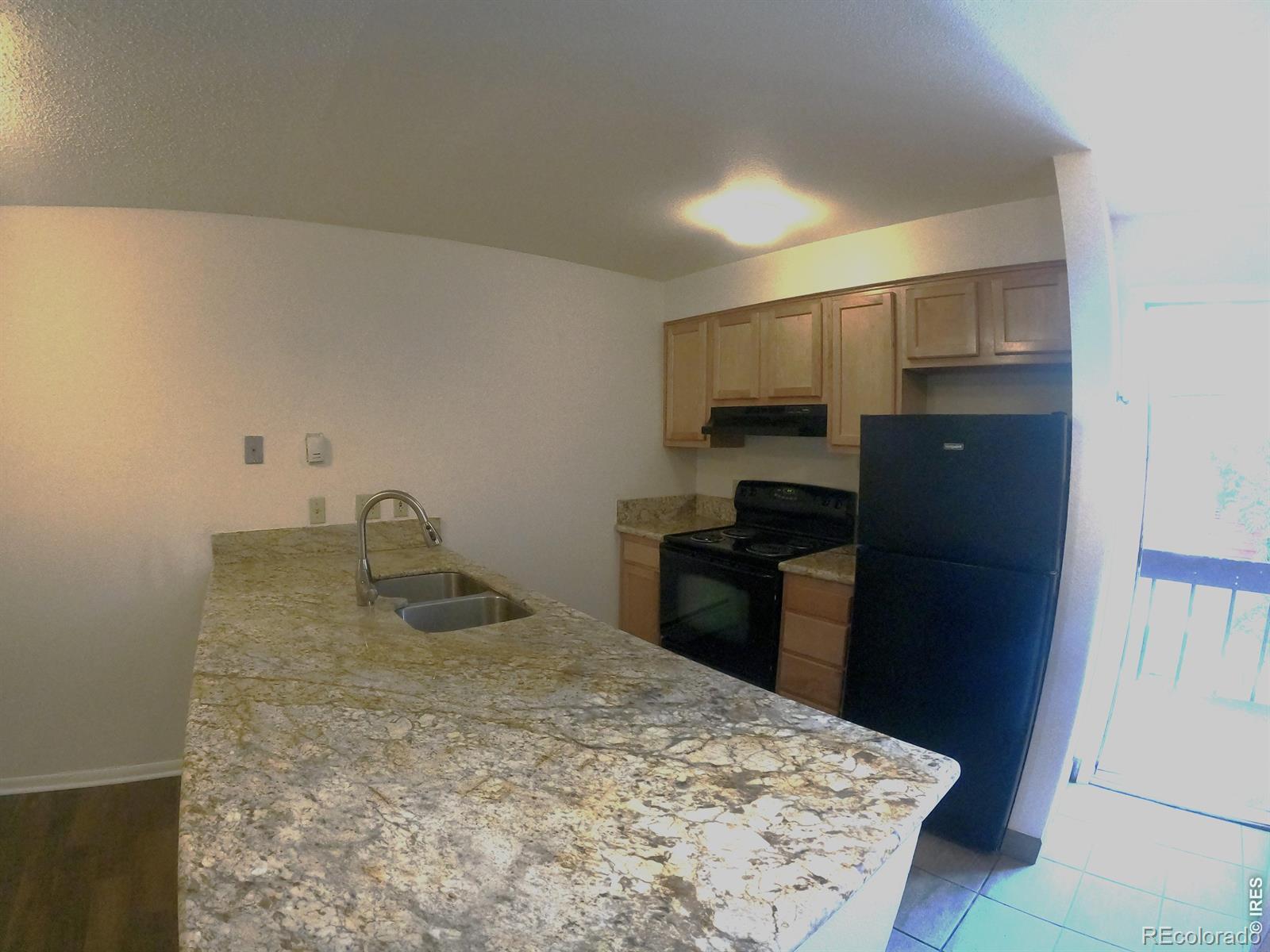 Image 3: Updated Kitchen w/ Granite, Maple Cabs & Black appliances.  (photos courtesy of Sunnyside Rentals when it was vacant)
