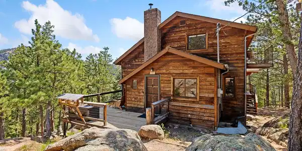 Image 2: Front door with deck and beautiful rock outcroppings Image 2: Front door with deck and beautiful rock outcroppings