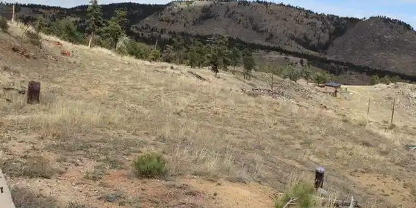 Image 3: Driveway Turn around with well head in the lower foreground