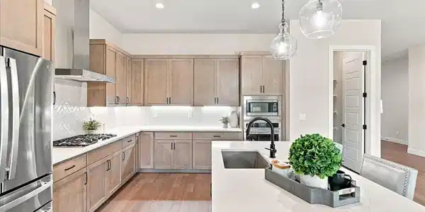 Image 3: The gourmet kitchen is truly the heart of the home. Under-cabinet lighting creates both function and ambiance. Upgraded stainless steel appliances complete this chef-inspired kitchen. Image 3: The gourmet kitchen is truly the heart of the home. Under-cabinet lighting creates both function and ambiance. Upgraded stainless steel appliances complete this chef-inspired kitchen.