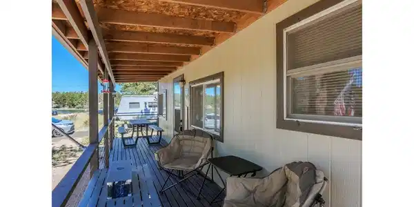 Image 3: Relax on the Covered Front Porch and watch the time go by. Image 3: Relax on the Covered Front Porch and watch the time go by.