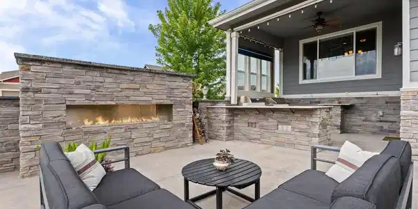 Image 2: custom-built 6-foot stone fire feature serves as the perfect centerpiece for your outdoor oasis, ensuring warmth and ambiance for year-round entertaining. Image 2: custom-built 6-foot stone fire feature serves as the perfect centerpiece for your outdoor oasis, ensuring warmth and ambiance for year-round entertaining.