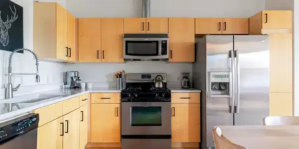 Image 4: The kitchen features newer quartz countertops, upgraded appliances and plenty of storage Image 4: The kitchen features newer quartz countertops, upgraded appliances and plenty of storage