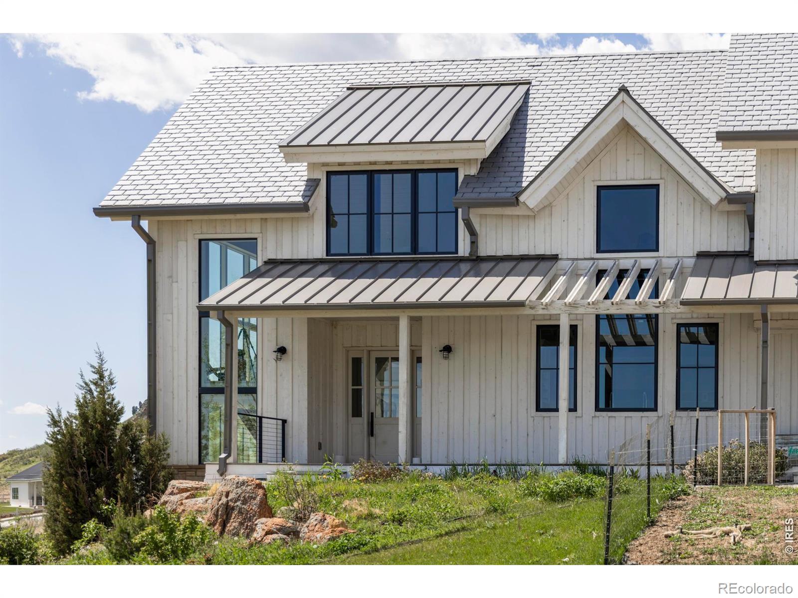 Image 3: The property includes a five-bedroom main residence, a resort-style recreation center, a custom barn with guest apartment, and extensive equestrian amenities with direct access to White Ranch Park.