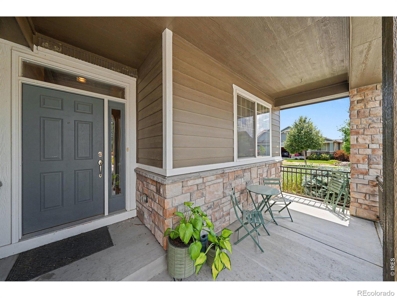 Image 4: Start your mornings here with coffee or unwind in the evenings on the inviting covered front porch Image 4: Start your mornings here with coffee or unwind in the evenings on the inviting covered front porch