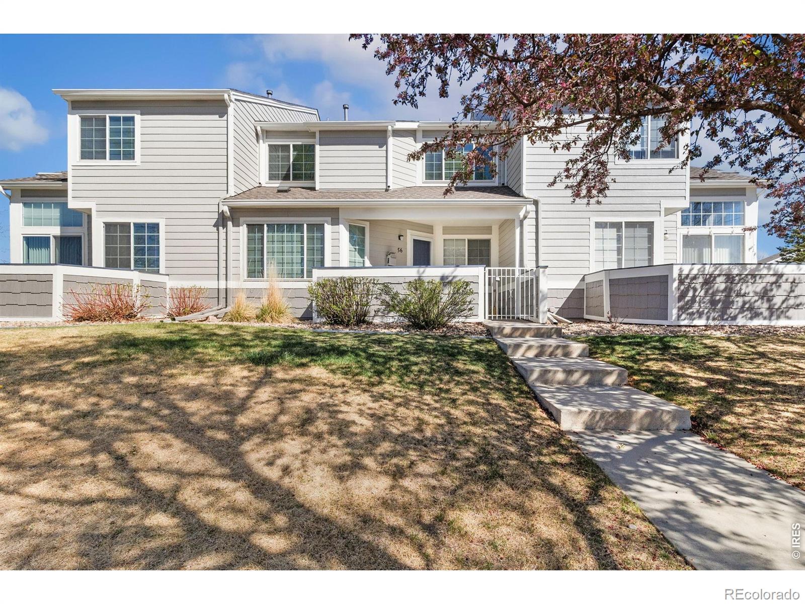 Image 2: South-facing exterior with mature trees Image 2: South-facing exterior with mature trees