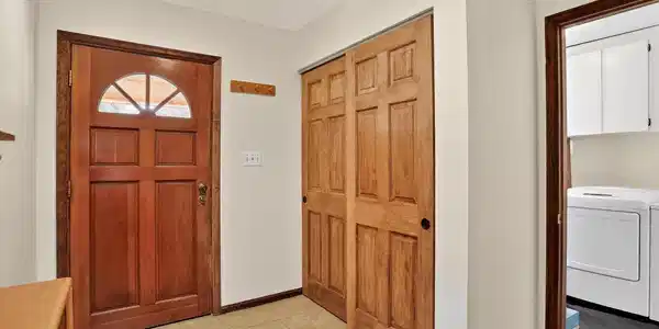 Image 4: Foyer with Washer/Dryer and a closet adjacent to front door Image 4: Foyer with Washer/Dryer and a closet adjacent to front door