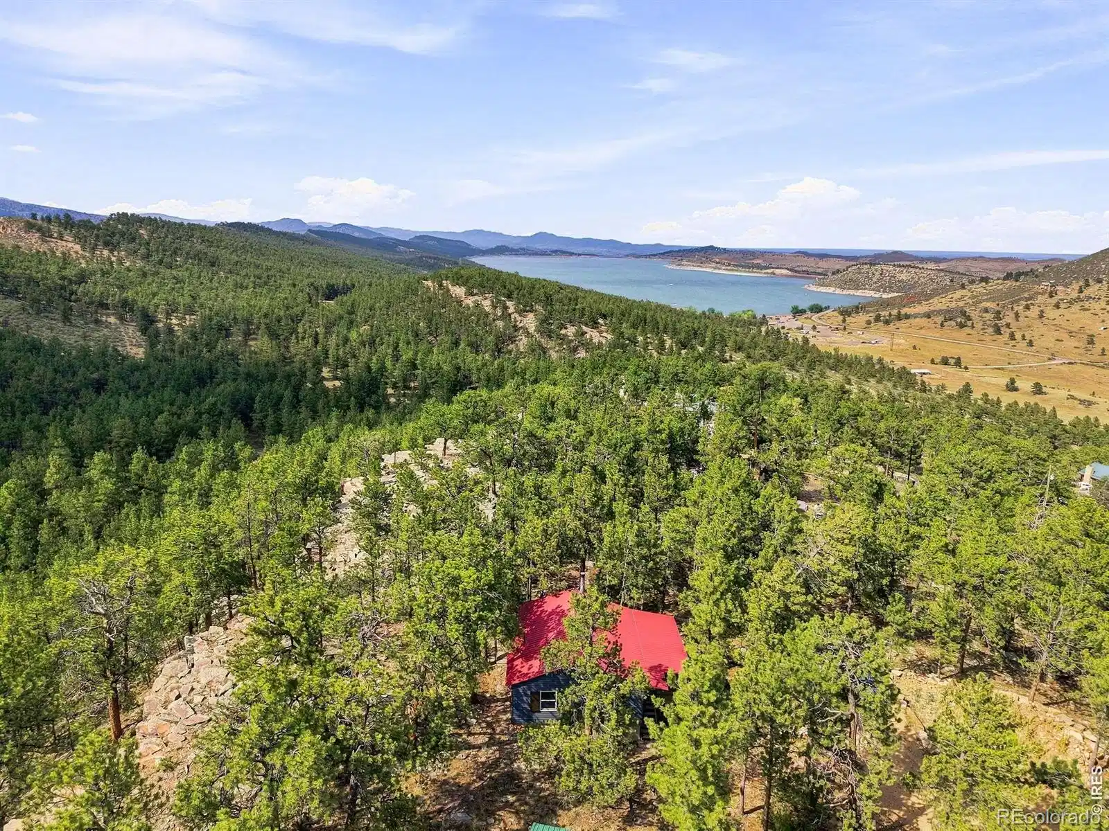Image 1: Perched above Carter lake, this is truly paradise