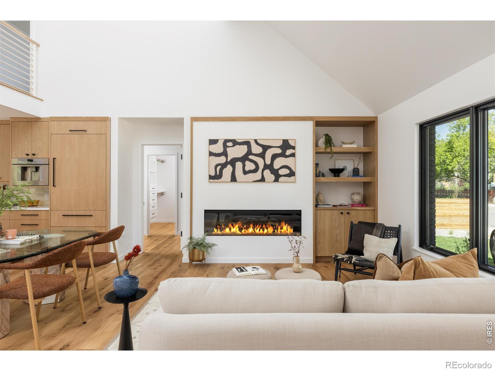 Image 3: Double-height ceilings, expansive windows, and a linear fireplace anchor the light-filled living room. Image 3: Double-height ceilings, expansive windows, and a linear fireplace anchor the light-filled living room.