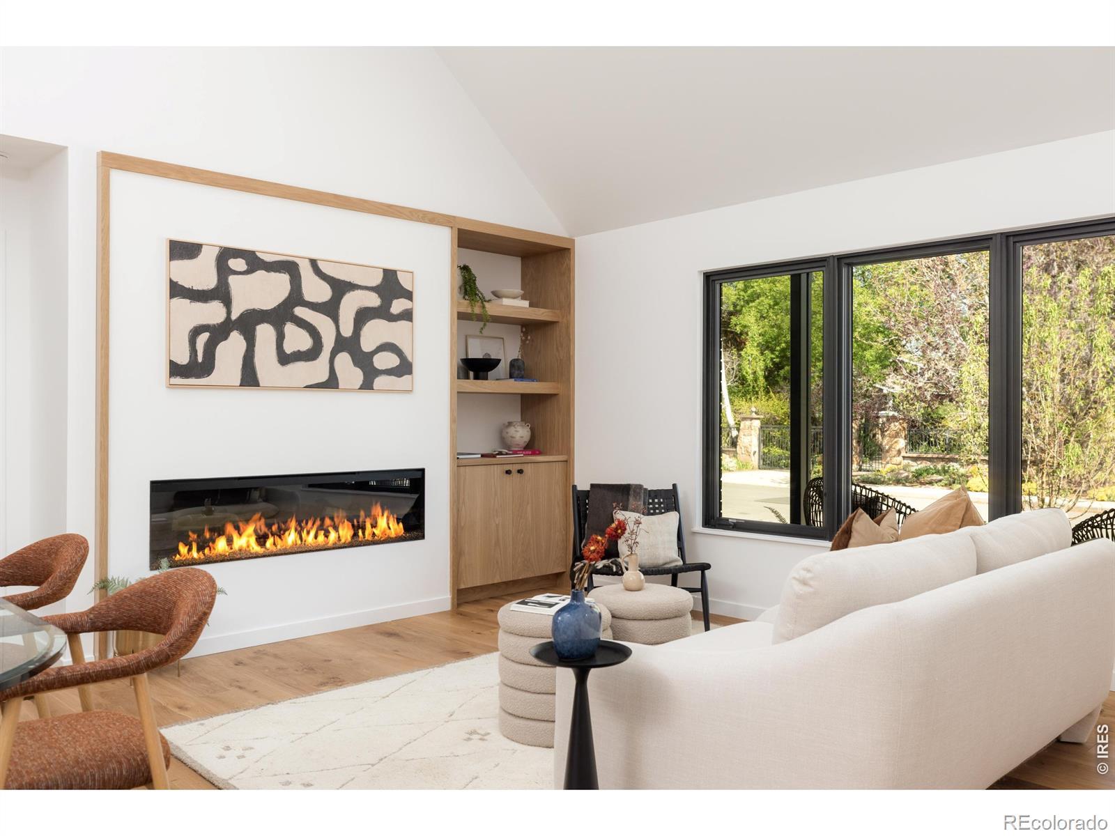 Image 4: The living room seamlessly connects to the outdoors through expansive sliding glass doors, bringing natural light into every corner. Image 4: The living room seamlessly connects to the outdoors through expansive sliding glass doors, bringing natural light into every corner.