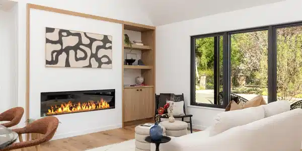 Image 4: The living room seamlessly connects to the outdoors through expansive sliding glass doors, bringing natural light into every corner. Image 4: The living room seamlessly connects to the outdoors through expansive sliding glass doors, bringing natural light into every corner.