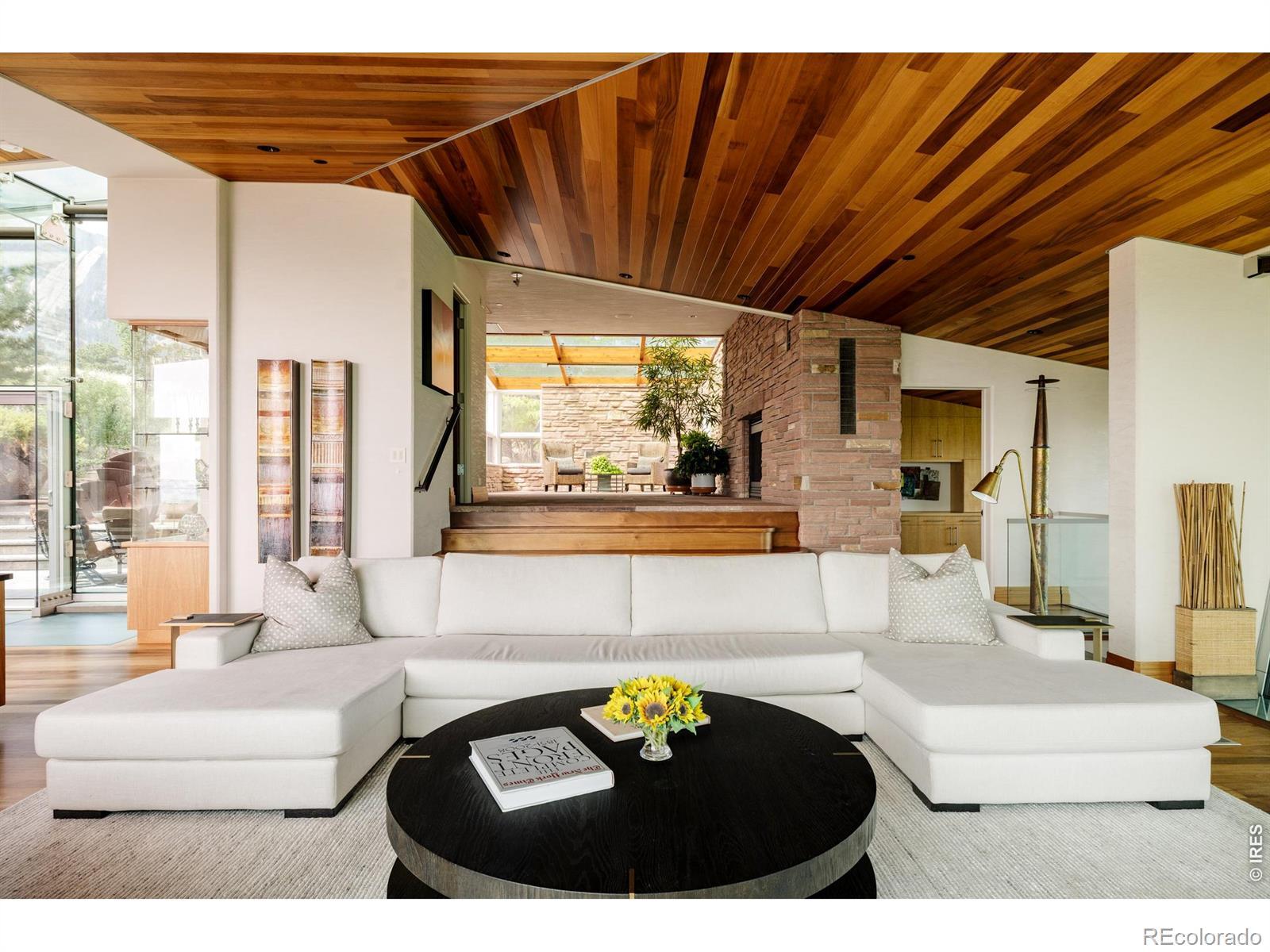 Image 4: Directly off of the main entrance is your living room featuring Honduran mahogany ceilings Image 4: Directly off of the main entrance is your living room featuring Honduran mahogany ceilings