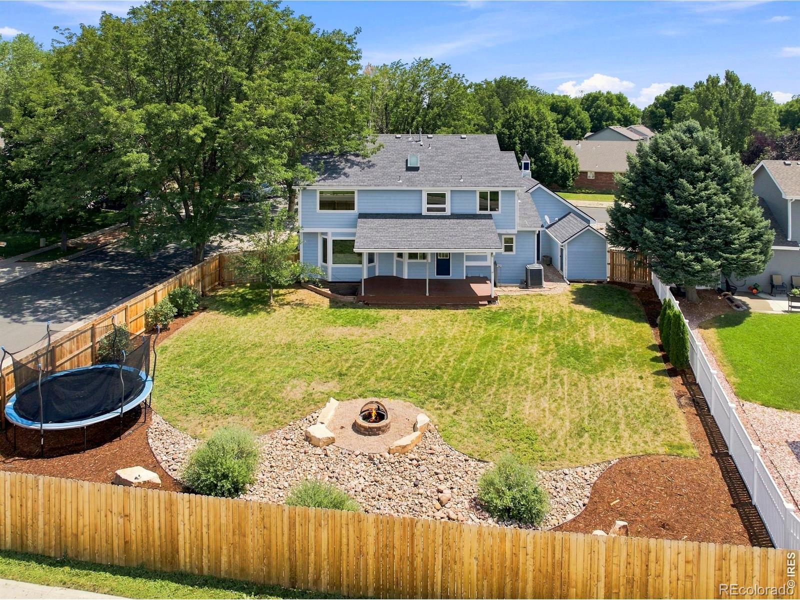Image 3: Very spacious, landscaped backyard with fire pit and covered deck. Perfect for entertaining! Image 3: Very spacious, landscaped backyard with fire pit and covered deck. Perfect for entertaining!