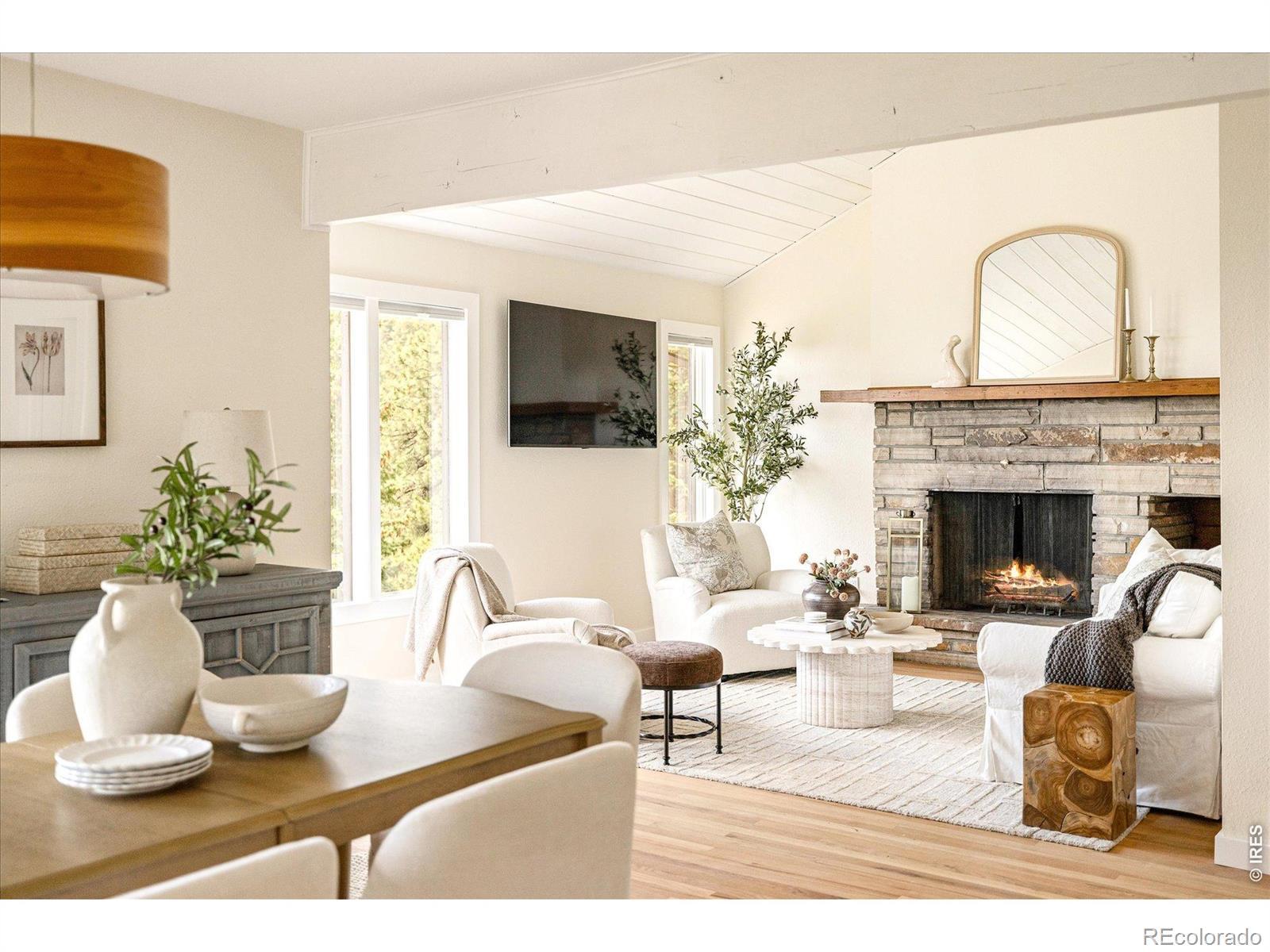 Image 2: Living Room + Dining Room with Ample Natural Light