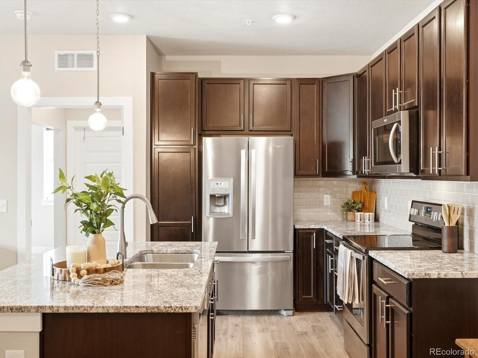 Image 1: Stainless steel appliances and granite countertops Image 1: Stainless steel appliances and granite countertops