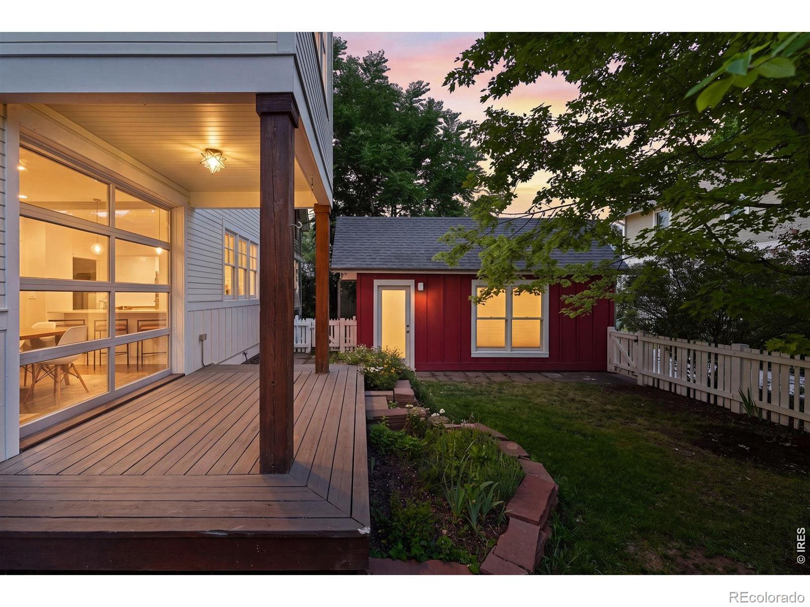 Image 2: The private backyard, with its covered deck and white picket fence, is an ideal spot to spend an evening with friends. Image 2: The private backyard, with its covered deck and white picket fence, is an ideal spot to spend an evening with friends.