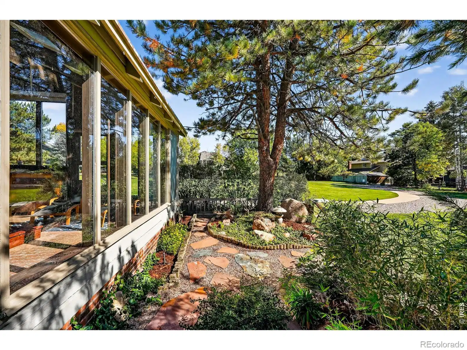 Image 1: At the end of a peaceful cul-de-sac in Gunbarrel, this rare end-unit lives like a retreat, surrounded by openness and quiet.