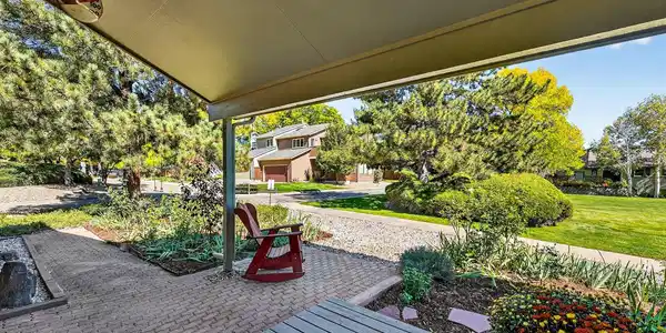 Image 3: Start your day here, coffee in hand, tucked beneath the shelter of the front porch.