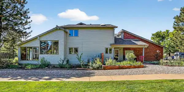 Image 4: Wrapped by sweeping community open space on two sides, the setting feels open, light-filled, and beautifully expansive.