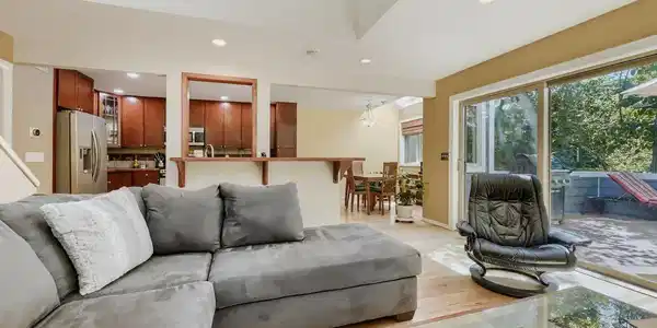 Image 2: The living room opens to a south-facing patio Image 2: The living room opens to a south-facing patio