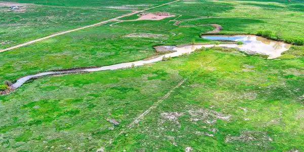 Image 4: Creek into reservoir from above looking east Image 4: Creek into reservoir from above looking east