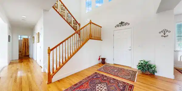 Image 3: Front Foyer and Stairway to the Upper Level