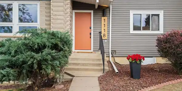 Image 4: Mosey up the front walk to be greeted by fresh exterior paint and a pop of color on the front door Image 4: Mosey up the front walk to be greeted by fresh exterior paint and a pop of color on the front door