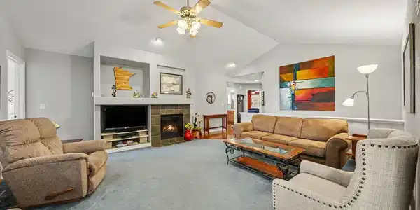 Image 4: Large vaulted Living Room welcomes everyone - enhanced with cozy fireplace and ceiling fan. Image 4: Large vaulted Living Room welcomes everyone - enhanced with cozy fireplace and ceiling fan.