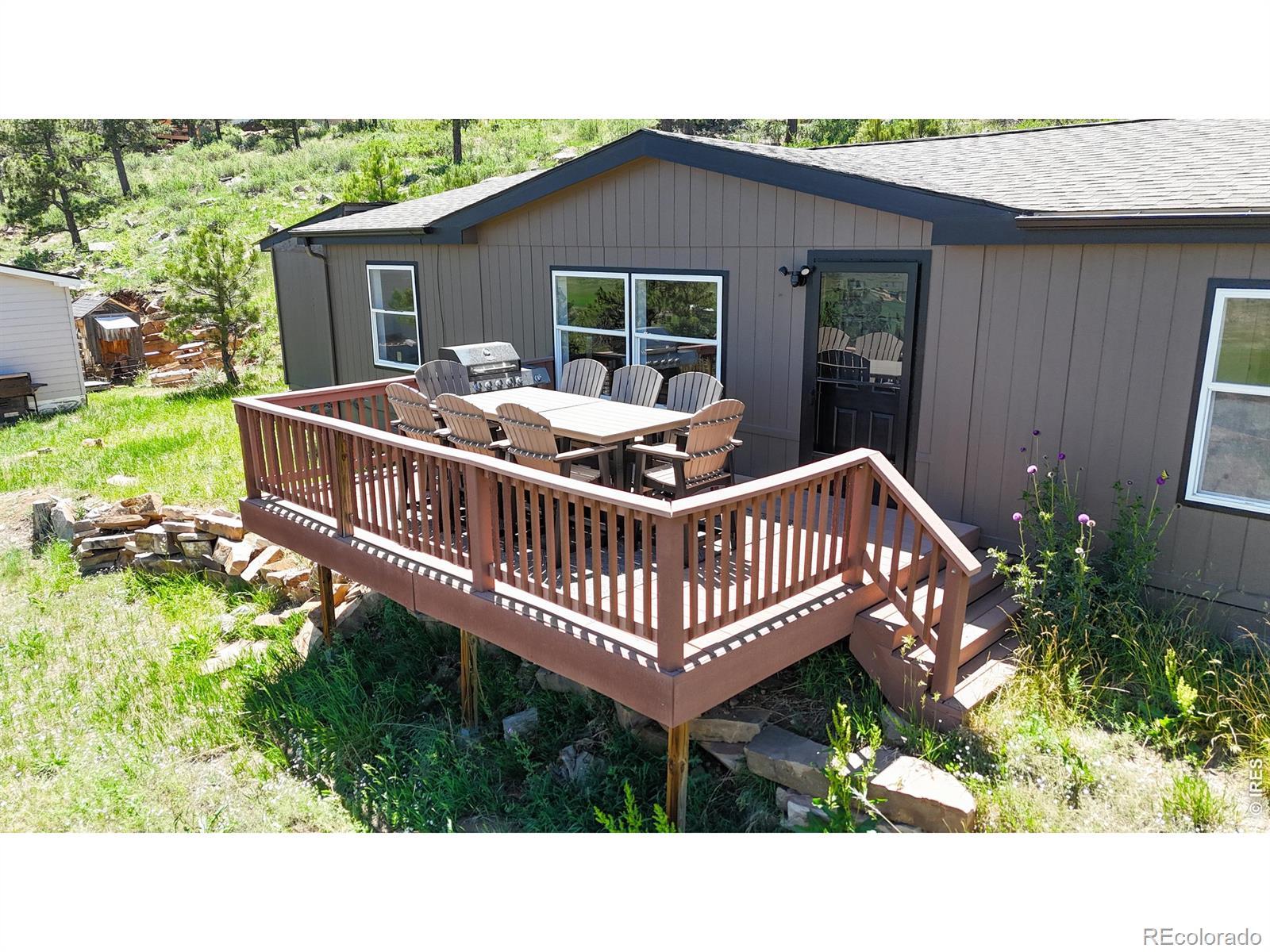 Image 3: New front porch faces East, making a great area to sit and take in the mountain air watching the sunrise.
