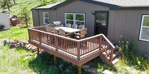 Image 3: New front porch faces East, making a great area to sit and take in the mountain air watching the sunrise.