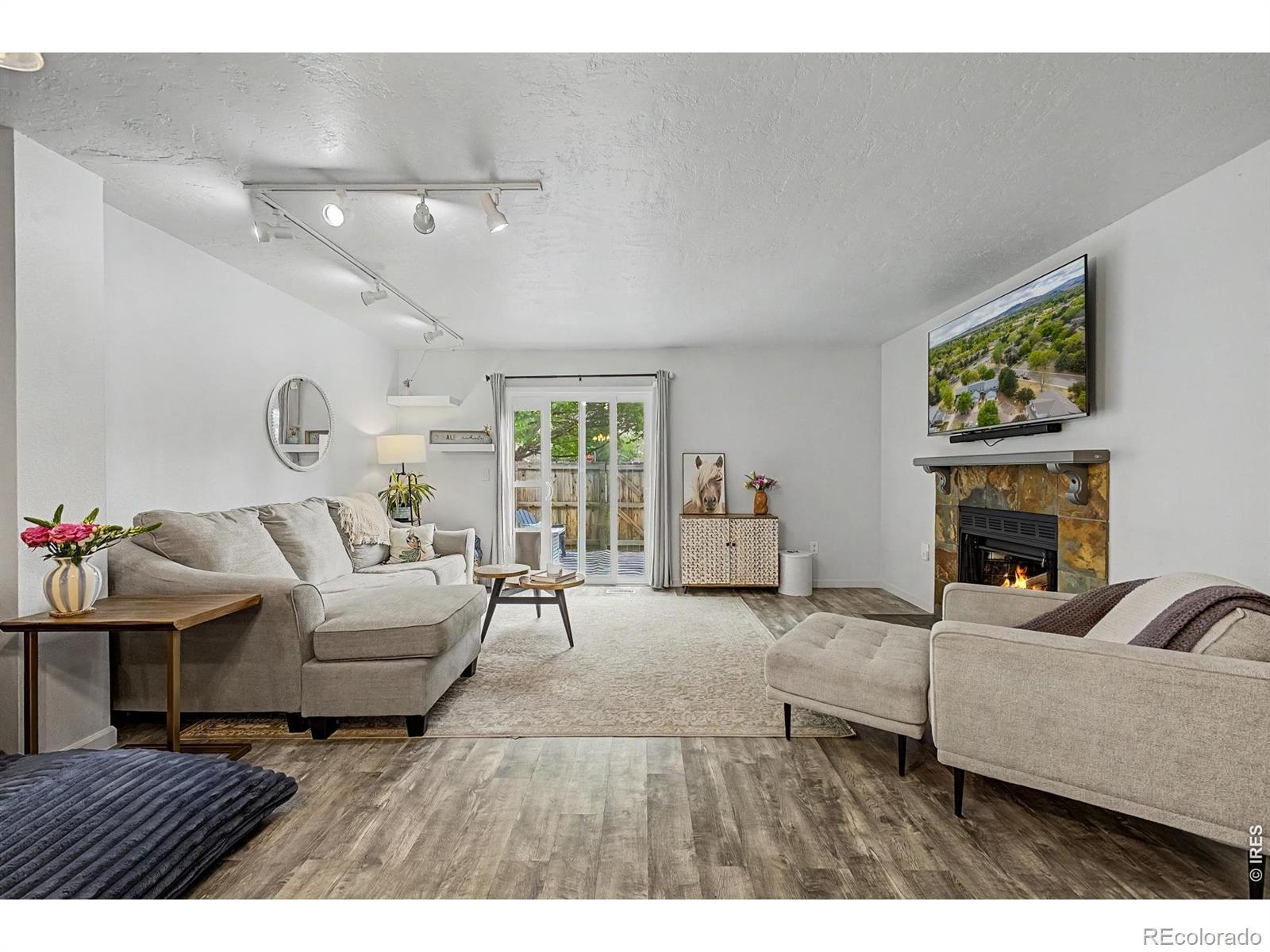 Image 3: Spacious living room with a cozy wood burning fireplace!
