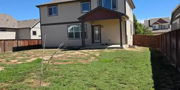 Image 3: Back Yard View of Covered Patio