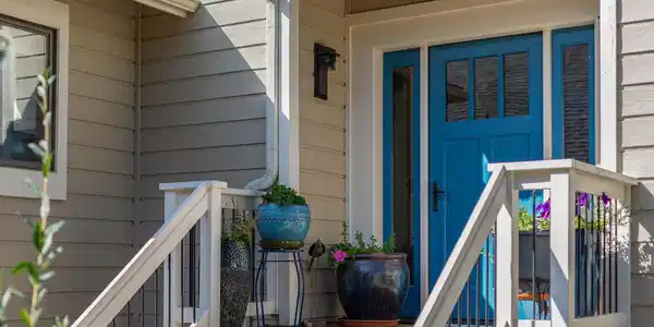 Image 2: A cheerful blue front door and welcoming entry introduce the home with a bright pop of color. Image 2: A cheerful blue front door and welcoming entry introduce the home with a bright pop of color.