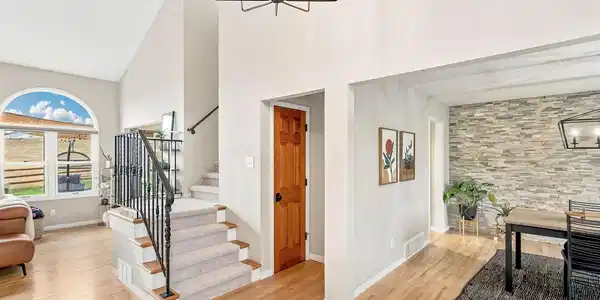 Image 4: Beautiful wood floors throughout the main level. Image 4: Beautiful wood floors throughout the main level.