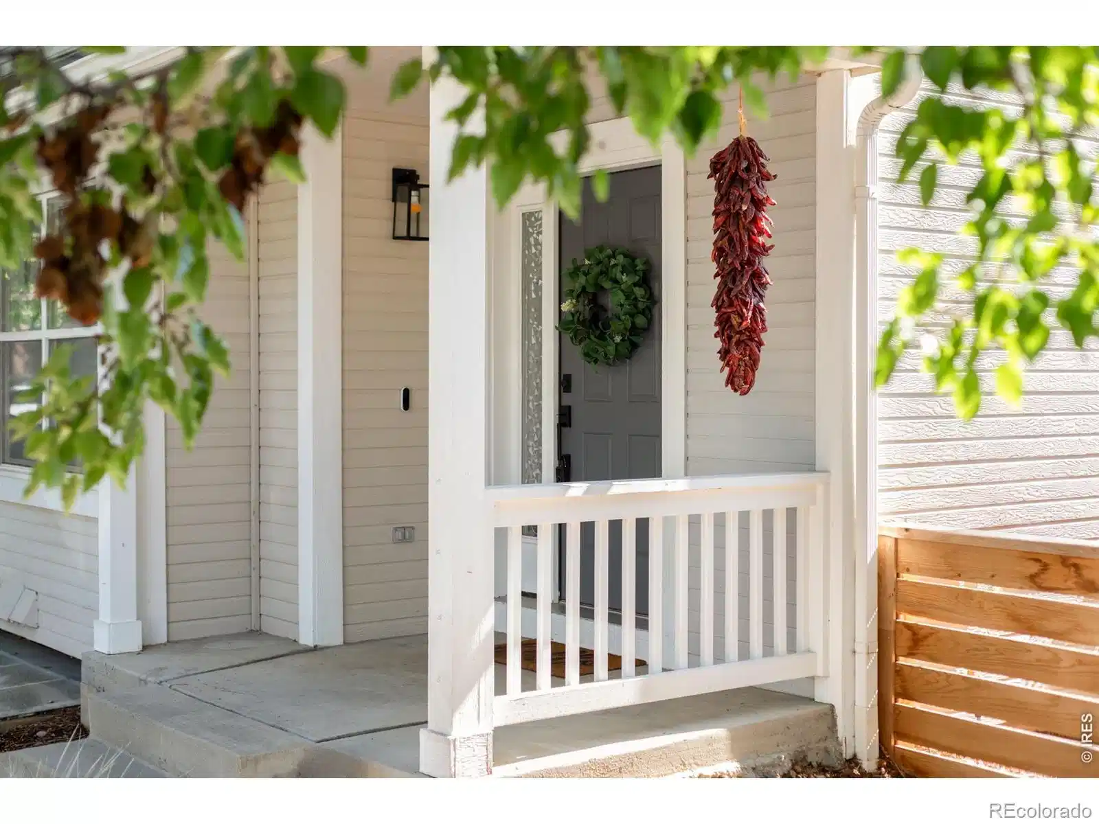 Image 1: In Dakota Ridge, one of North Boulders most connected and community-driven neighborhoods, 4954 10th Street sits along a quiet, tree-lined street where daily life naturally extends outdoors.